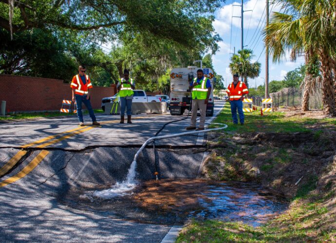 Large sinkhole on Wymore Road in Maitland, Florida - Close up view of pavement collapse.